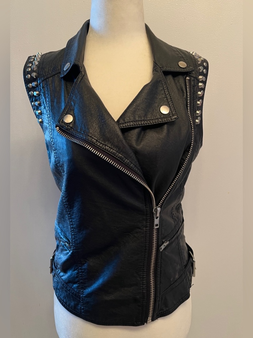 Moto faux leather vest featuring silver stud embellishments on the shoulders S